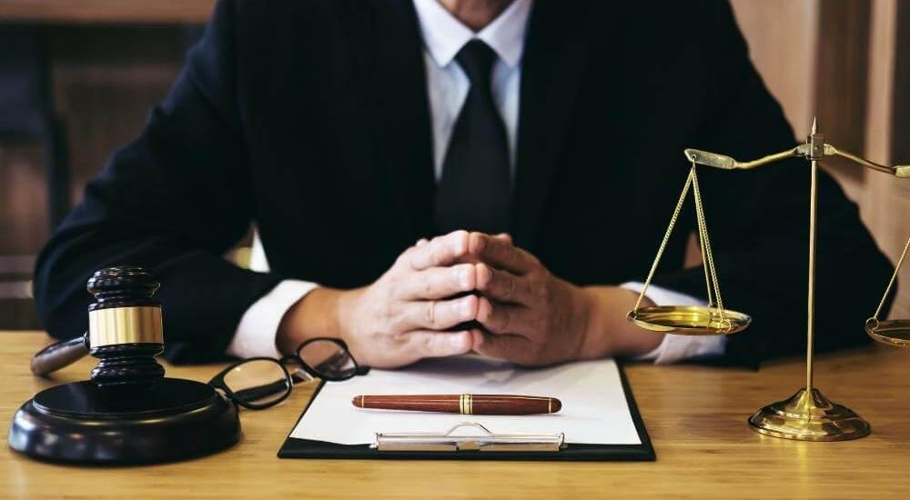 Virginia license suspension lawyer at desk with a