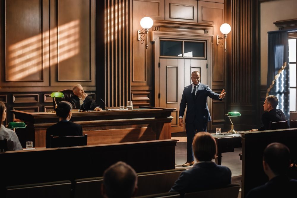 Attorney passionately delivers closing argument in a dramatic courtroom setting, under warm lighting.