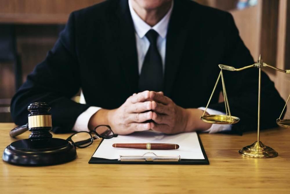 Virginia license suspension lawyer at desk with a